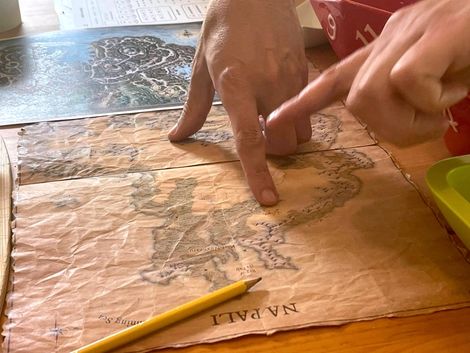 The party trying to decide which direction to take to get to Omu and the Heart of Ubtao as fast as possible.