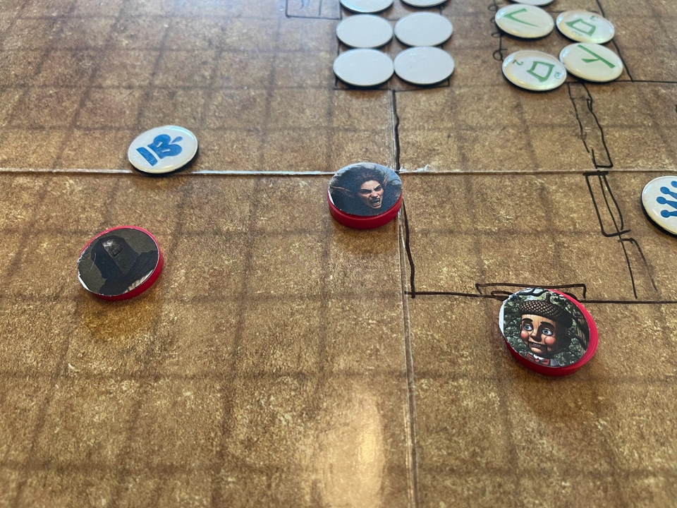 Lyra standing against the exterior prison wall while the guard and Gray prepare for the dangerous game.