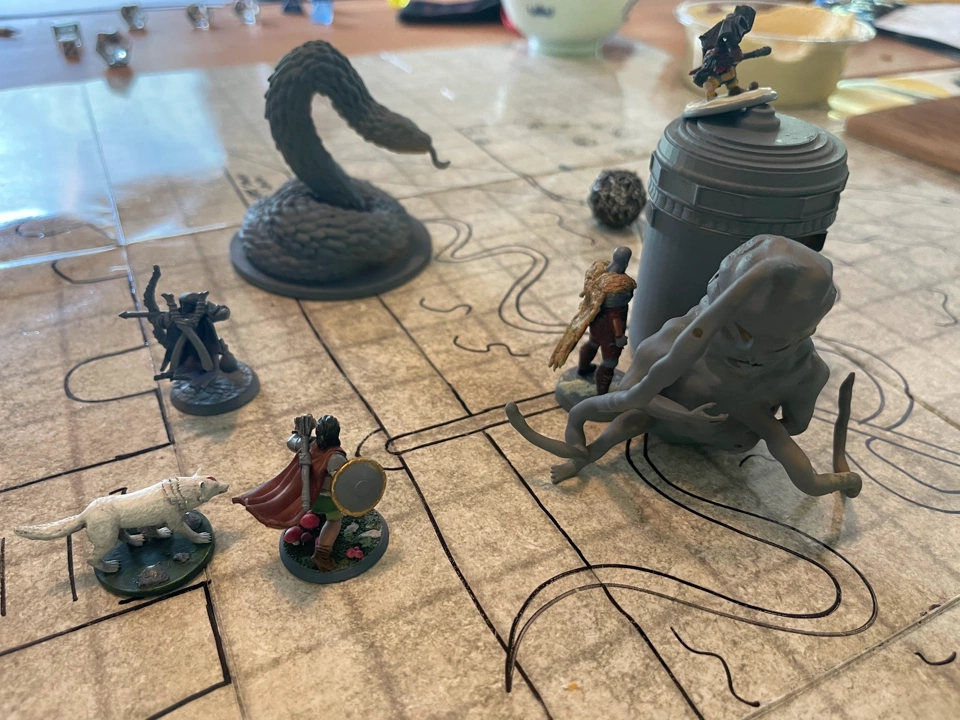 The heroes attacking the Soulmonger and its abomination defender.