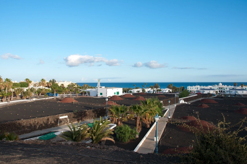 Black sand which is so typical from Lanzarote. We took that little trail to go to the beach and in search of dinner.