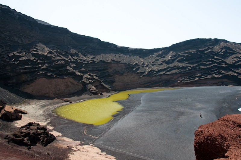 El Golfo was originally a full blown crater but time has taken its toll and has transformed it into the beach that you can see above. The atypical water color is due to the amount of minerals in the crater crust.