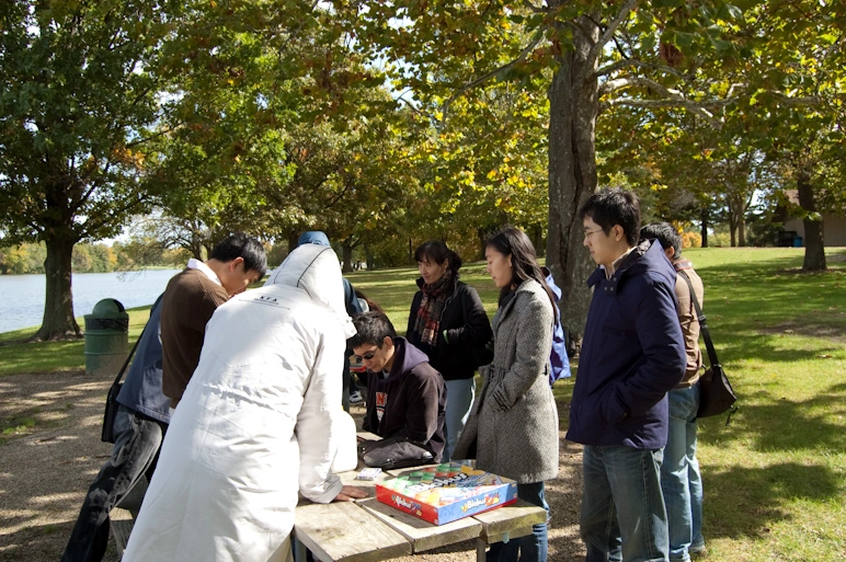 uiuc-timan-group-playing-game-in-a-park.webp