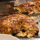 /attachments/trips/comida-japonesa/cocinando-okonomiyaki-delante-tuyo-en-restaurante_hu_d3a65d84996c2b16.webp
