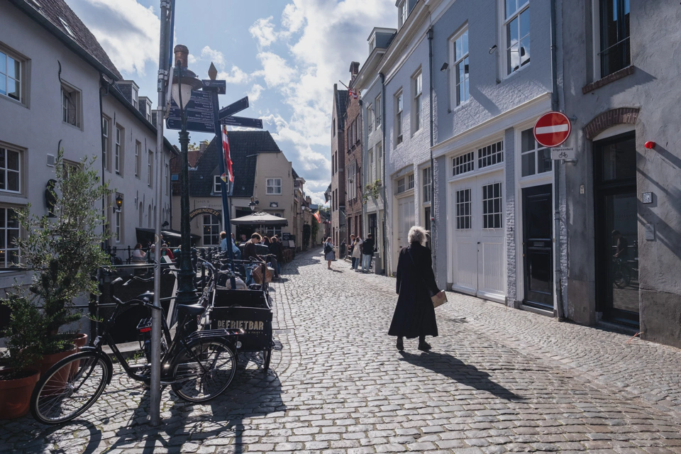 Den Bosch street lit by the afternoon sun.