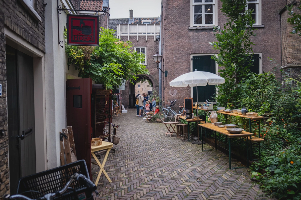 A small street with old buildings originally dedicated to tasks like monitoring imported goods.