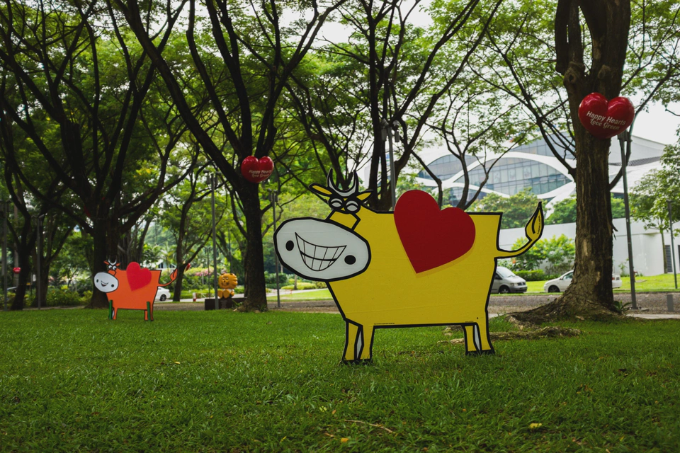 The red hearts say ‘Happy hearts love green’. I can only assume that the function of this grass field full of cows and hearts is to make people conscious about the environment.