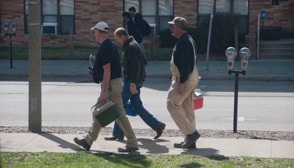 maintenance-workers-walking-on-the-street.webp